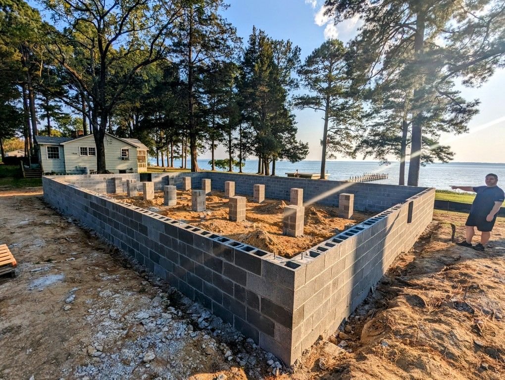 Mobile home leveling equipment and piers being adjusted by Dream Home Mover